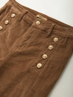 Calças bombazina com botões dourados