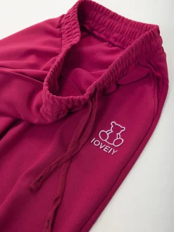 Calças com bordado urso