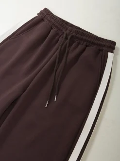 Calças desportivas com faixa lateral