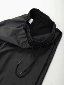 Calças efeito pele cintura elástica