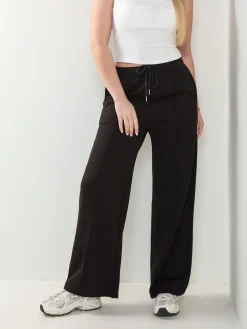 Calças fato treino com costura frontal