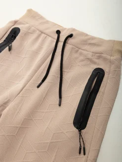 Calças fato treino malha texturizada