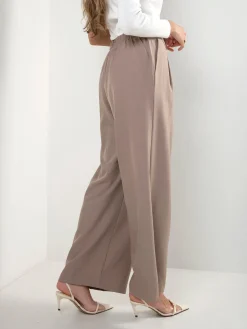 Calças fluídas cintura alta