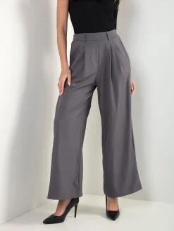 Calças fluídas cintura alta