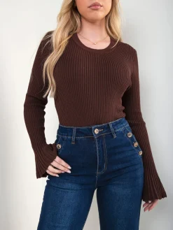 Calças ganga com botões dourados