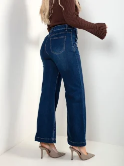 Calças ganga com botões dourados