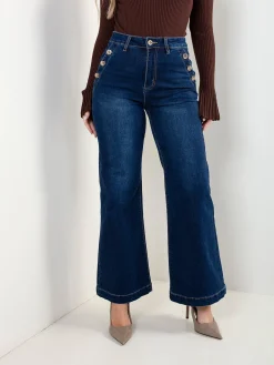 Calças ganga com botões dourados