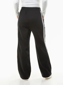 Calças largas riscas laterais