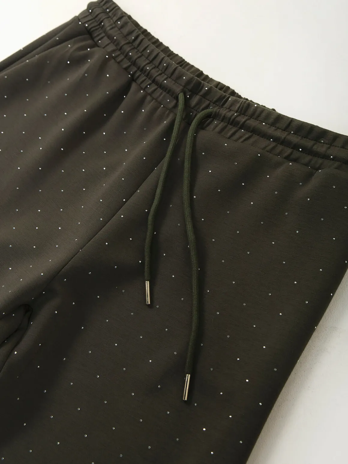 Calças malha com strass