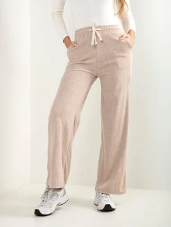 Calças malha efeito aveludado cintura alta