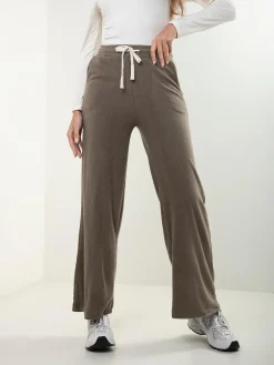 Calças malha efeito aveludado cintura alta