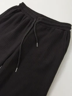 Calças malha largas interior cardado