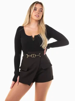 Calções alfaiataria com sobreposição