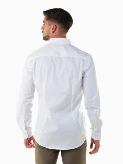 Camisa branca slim fit com símbolo