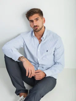 Camisa às riscas com símbolo