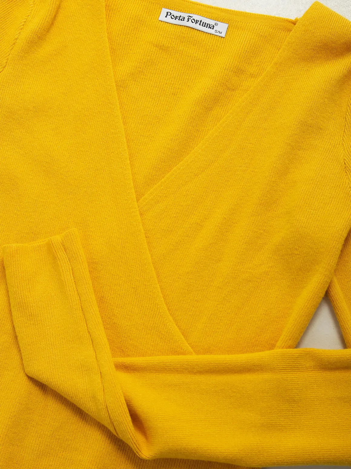 Camisola malha canelada com decote cruzado