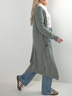 Casaco malha comprido com bolsos