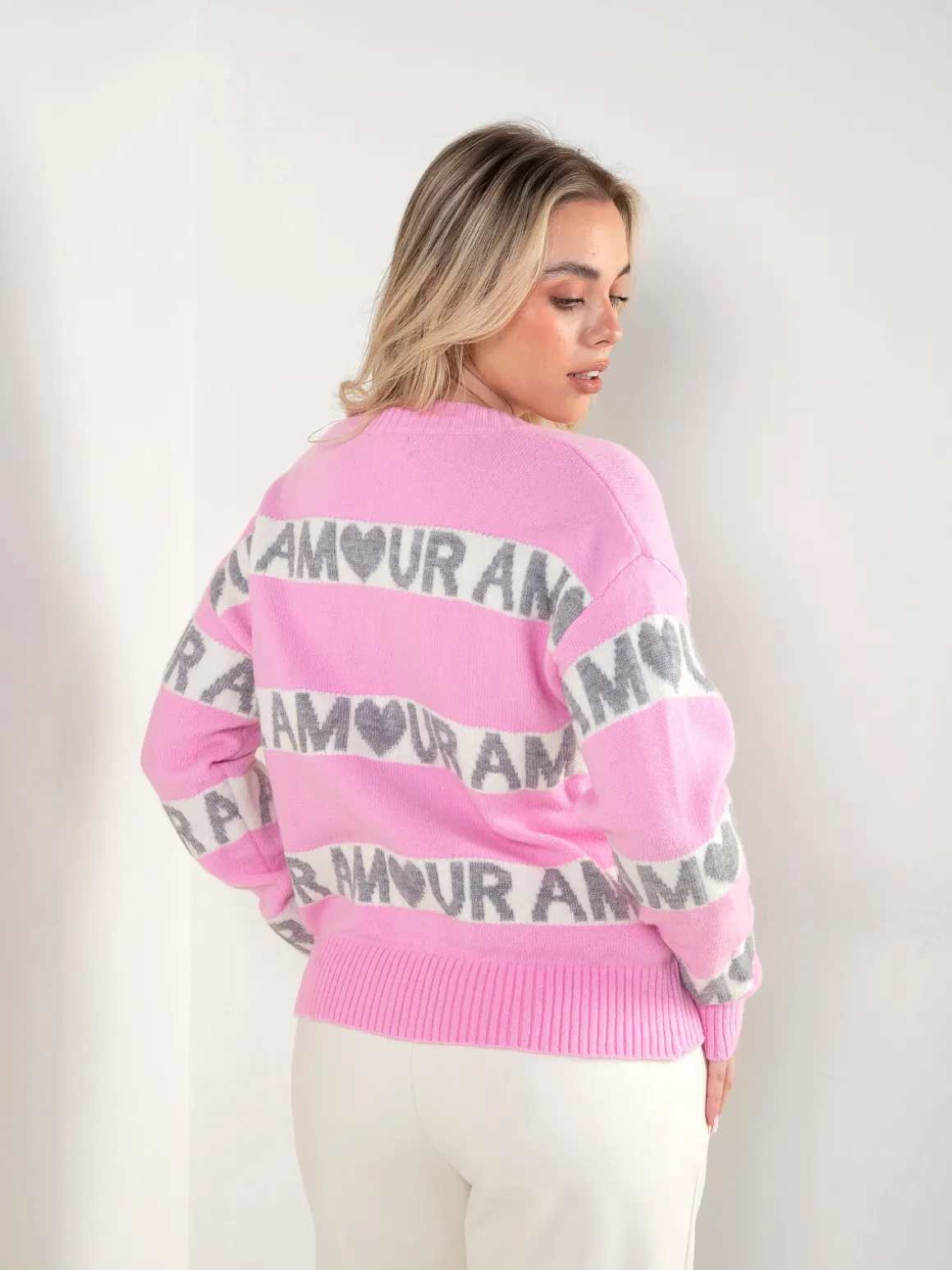 Casaco malha rosa com padrão contraste