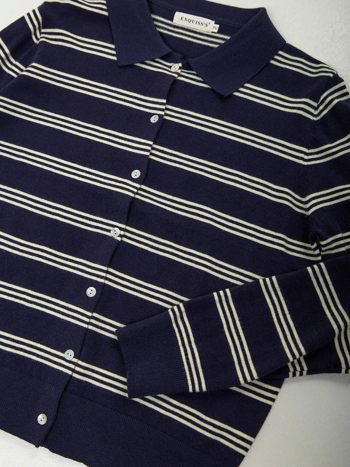 Casaco malha às riscas gola polo