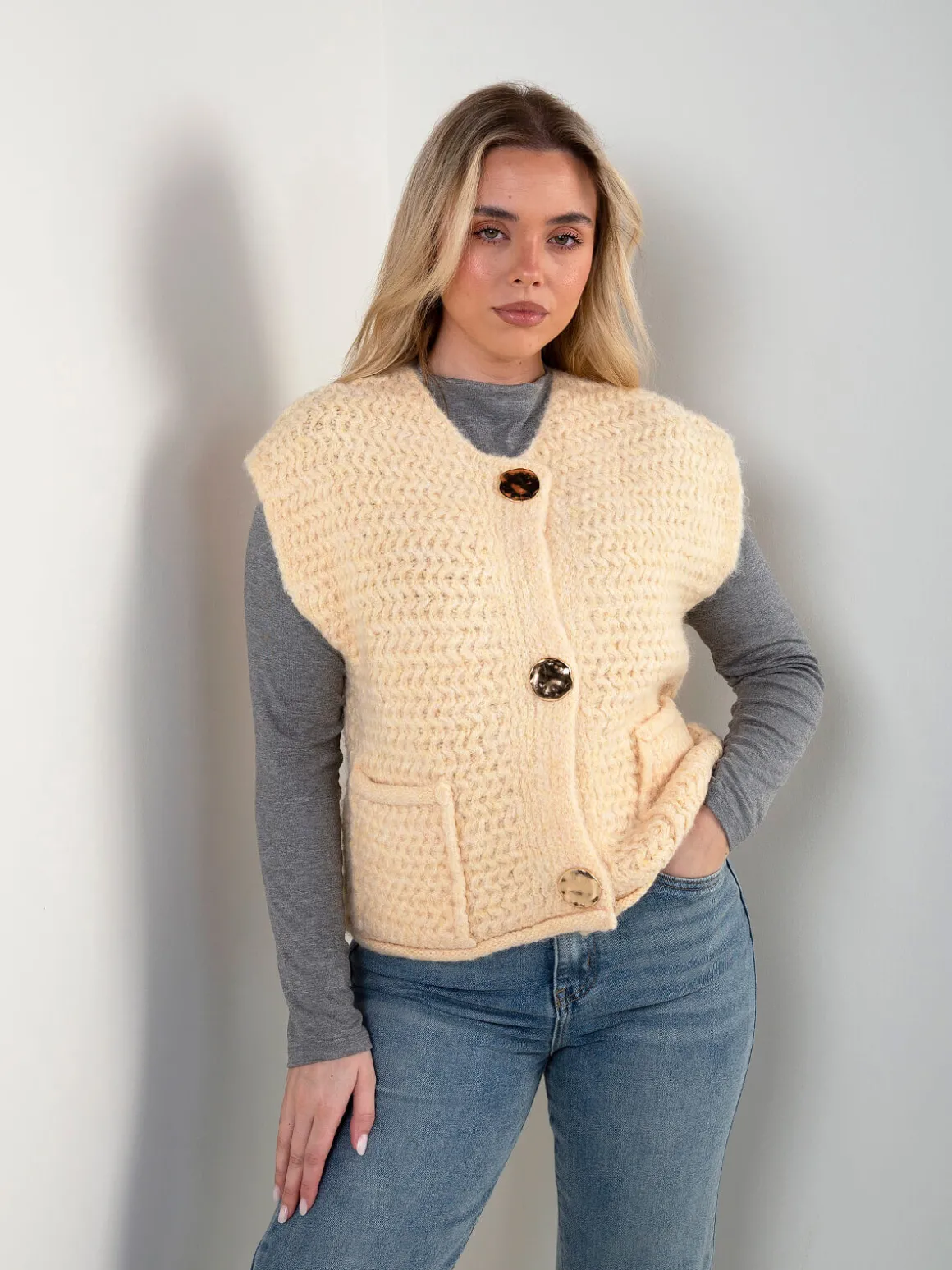 Colete malha com bolsos