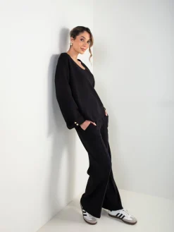 Conjunto malha preto camisola e calças